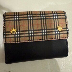 Authentic Burberry Black Leather bi-fold wallet